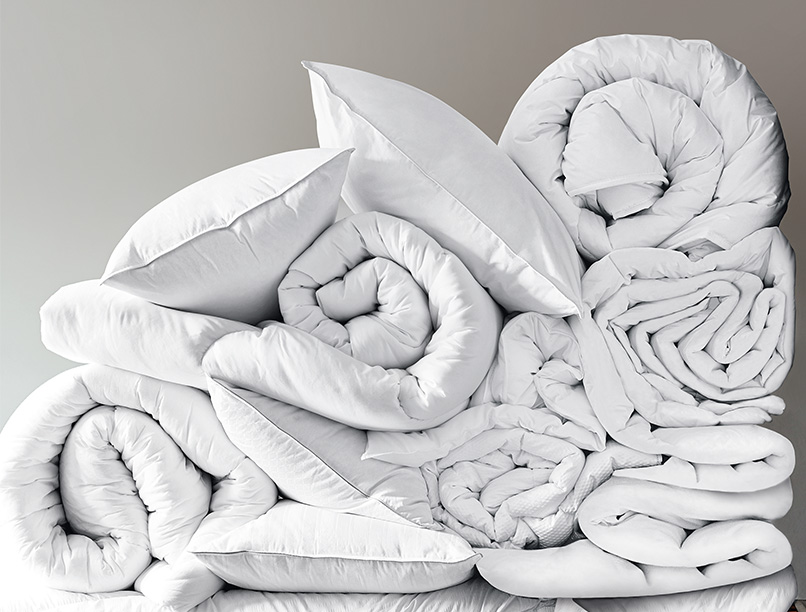 A collection of doonas and pillows