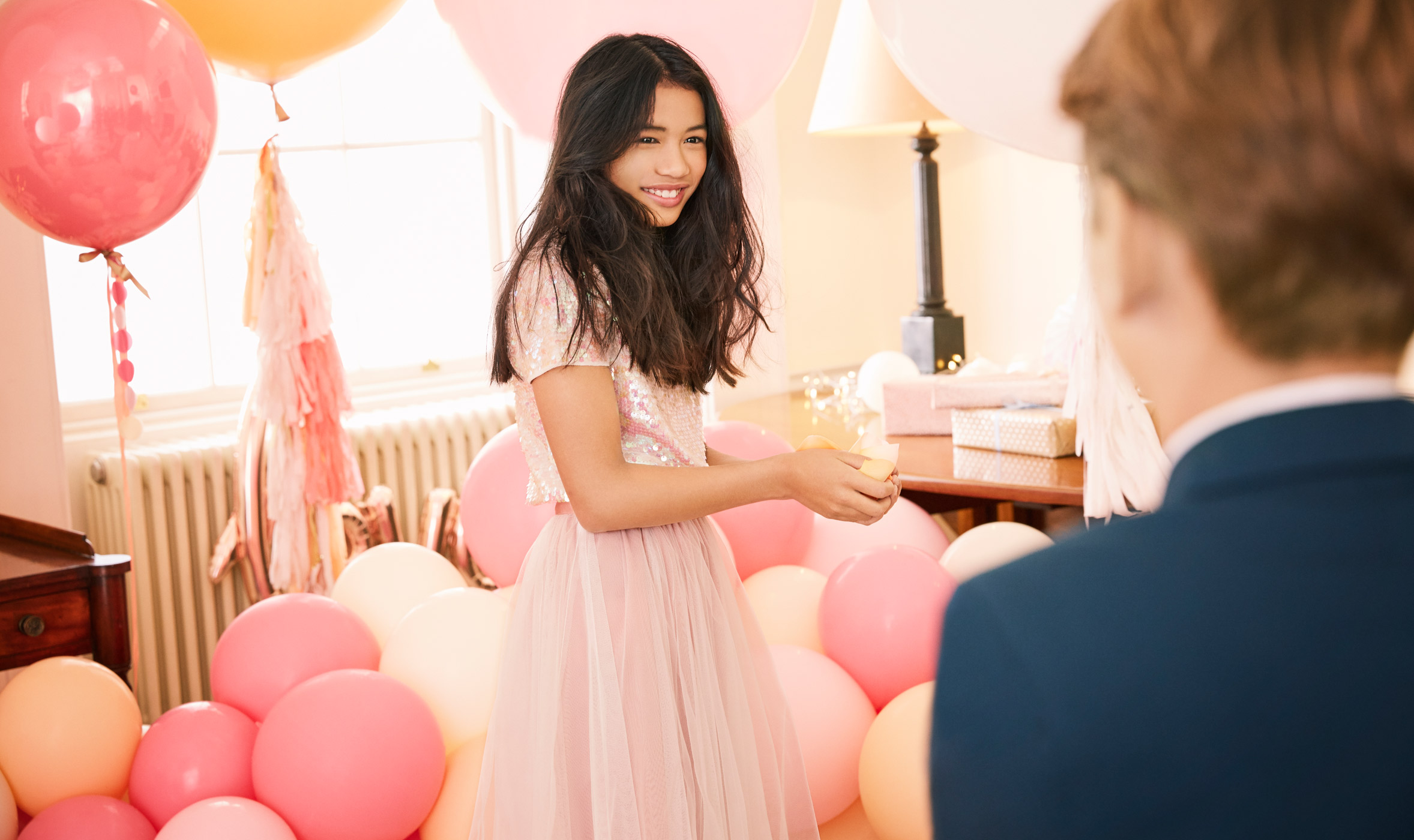 Girl in a sequined wedding outfit